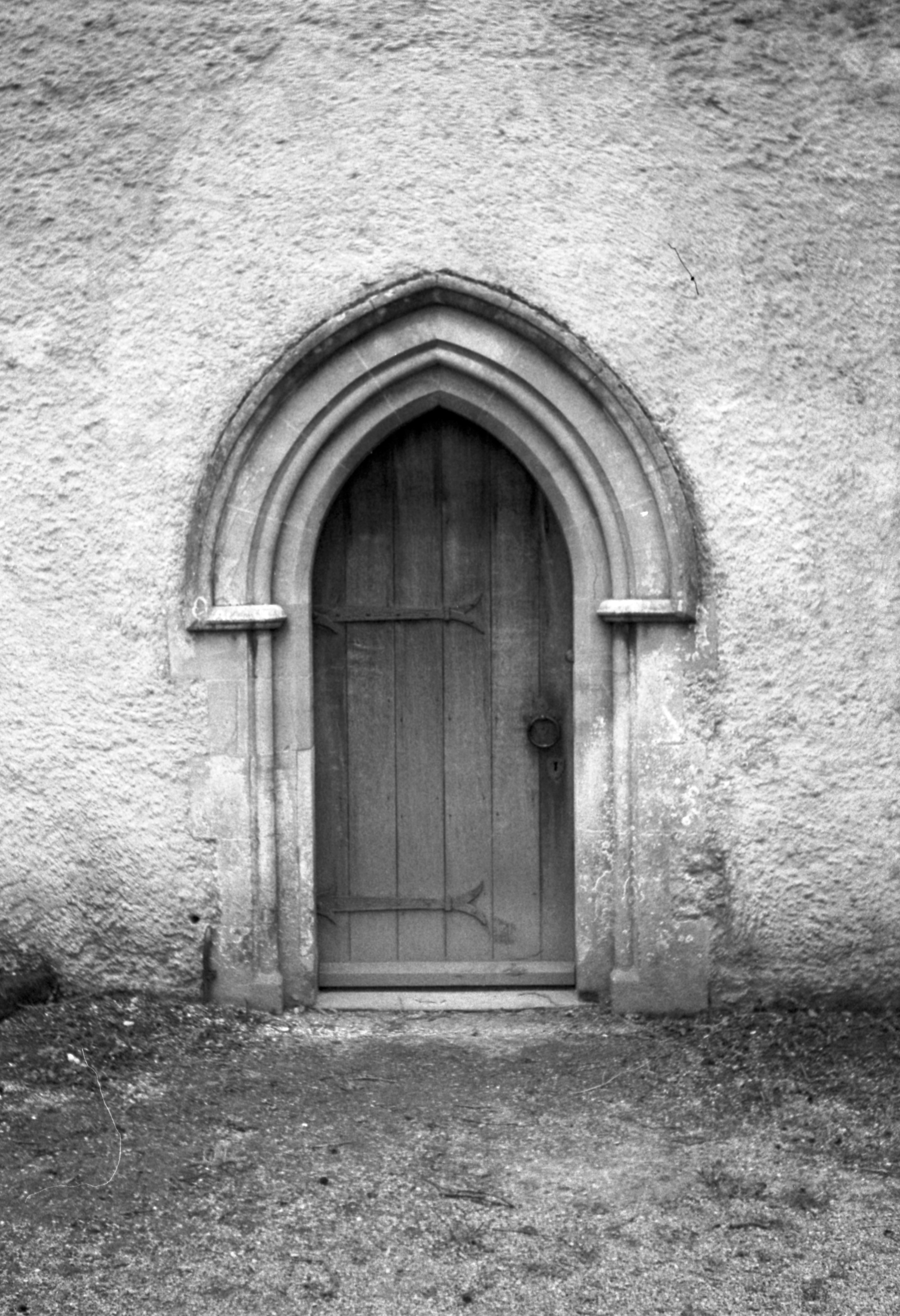 wooden door with concrete wall